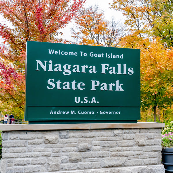 Autumn color foliage behind Niagara State park sign in New York USA