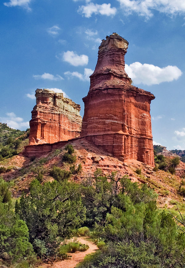 Lighthouse Rock Formation With Trees Around the Base in Palo Duro Canyon
