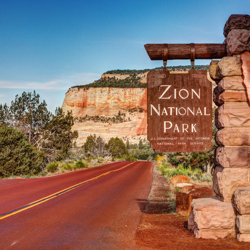 Zion National Park Sign with Mountains in background